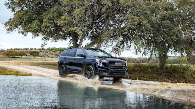 Marine Metallic GMC Terrain SLT Driving Off-Road through Water and Mud